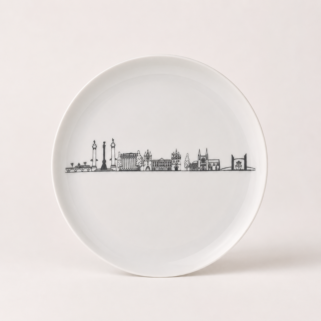 Assiette Bordeaux en porcelaine de 22 cm de diamètre décorée des monuments emblématiques de la ville